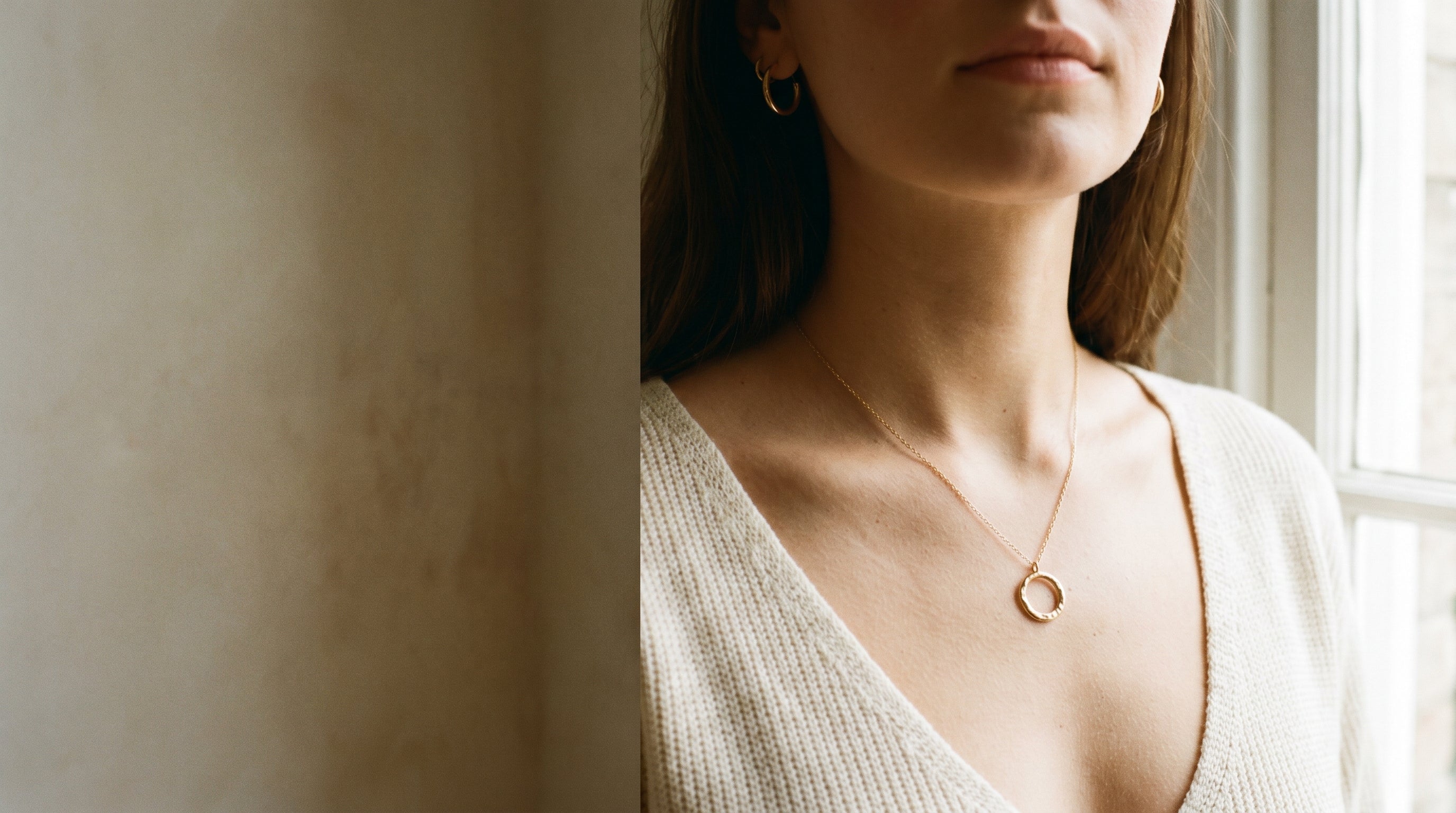 Woman wearing a delicate gold Jexyna pendant